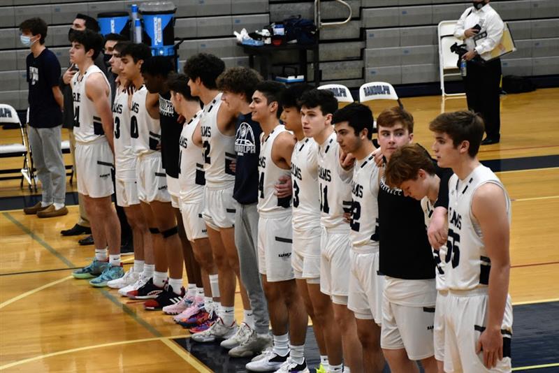 Members of the 2021-2022 varsity basketball team line up before a game against Mount Olive on Feb. 5, 2022. This year’s 2022-2023 team features a strong roster of both returning and new players.