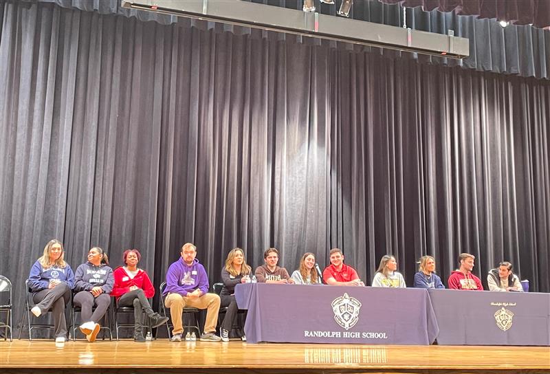 Twelve RHS alumni panelists share their insights on college life with hundreds of current seniors in the high school auditorium on Jan. 6, 2023.