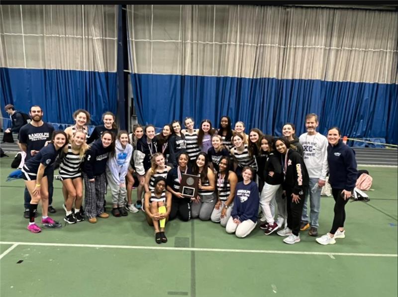 Members+of+the+Girls+Indoor+Track+team+gather+after+taking+the+Morris+County+Relay+Championships+title+on+Jan.+3%2C+2023.+