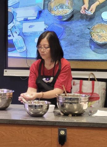 Mandarin teacher Harmony Waldron shows students the proper dumpling pinching technique at a Lunar New Year celebration, held in the culinary classroom on Jan. 25, 2023.
