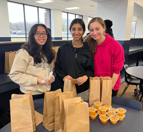 Bridges members help create the 300-plus bagged lunches the club donated to the homeless and financially struggling families in Newark as part of last months Project Kind. 