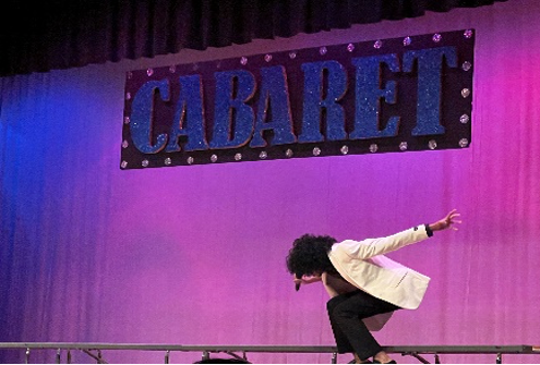 Accented by vibrant stage lights, junior Aydan Salim sings “Your Fault” from “Into the Woods” at Cabaret Night on Friday, Feb. 10. 