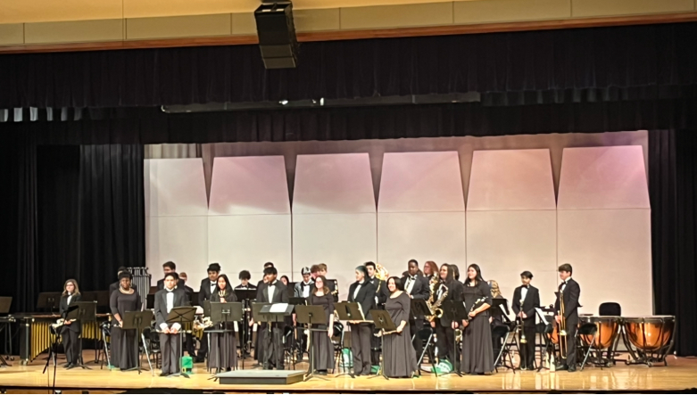 Members of the RHS Concert Band, directed by Michael Lichtenfeld, stand while taking in the applause at the Bands of Randolph Concert, held at the high school auditorium on Wednesday, March 1, 2023.