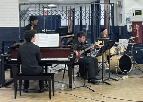 Freshman pianist Eli Kahn, junior bongo player Kavin Chandrasena, senior bass guitar player Andrew Berkemeyer, and sophomore percussionist Ben Herring provide unique accompaniments to the wind instruments at the Jazz Coffeehouse concert on Wednesday, Feb. 22, 2023. 
