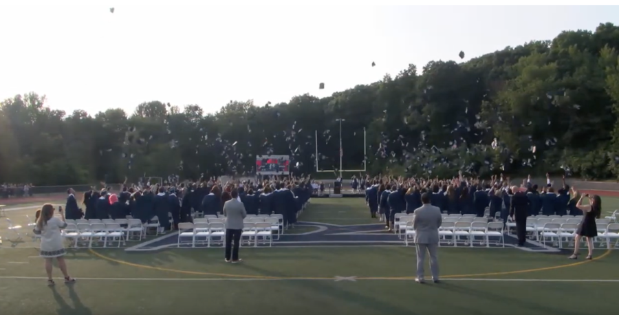 The 364 members of the RHS Class of 2023 toss their caps at the close of graduation. The ceremony was held at Bauer Field on June 15, 2023.
