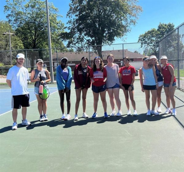 Members of the varsity Girls Tennis team invited members of the JV team to train with them at recent practice. Pictured, from left: Head Coach Daniel DiNozzi, Katherine Soo Hoo (JV), Kisa Mulondo (JV), Riyana Chaudhar (JV), Cassie Saltz (V) Monica Hurley (JV), Noelle Thompson (V), Ava Olsen (V), Lucy Girardi (V), and Livia Fontes (JV).