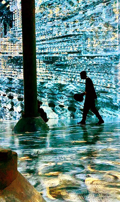 Liz Bukh achieves an illusive effect in her photo of a silhouette walking in front of a projected background. 