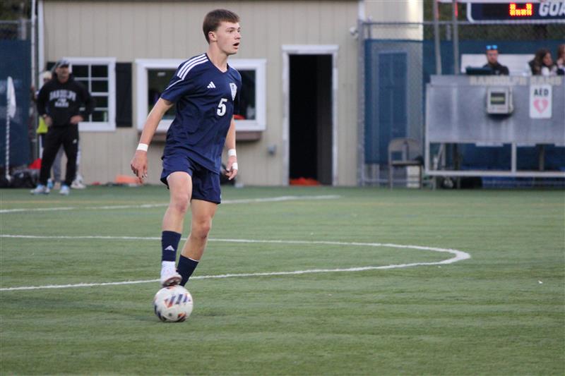 Sophomore RJ Dougherty assesses the field in a game against Roxbury this past fall. Boys Soccer ended the season with a 9-9 record.