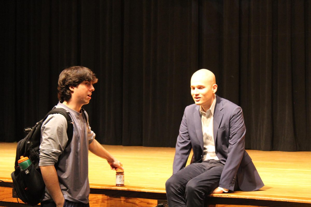 CBS Immigration Reporter and RHS Alumnus Camilo Montoya-Galvez  (15) speaks with senior John Krynicki after addressing the journalism, media and Heritage students at the high school on Friday, Oct. 27, in the auditorium. 