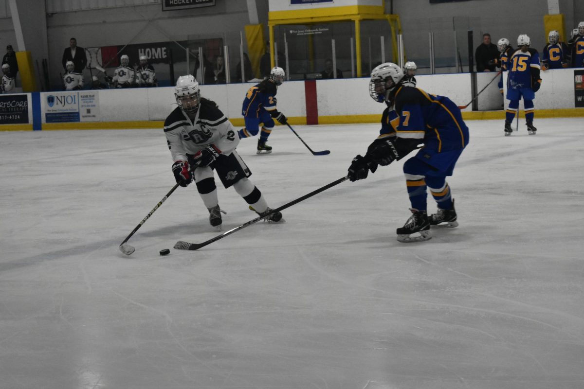 Senior Joelle Yurchuk skates down the ice with the puck on the way to beating Cranford, 7-1, on Wednesday, Dec. 13, 2023, in Girls Ice Hockeys season opener. 