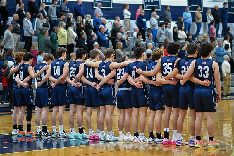Randolph Boys Varsity Basketball lines up for the national anthem before a disappointing, last-minute loss to Delbarton, 56-53, on Wednesday, Jan. 3, 2024.  