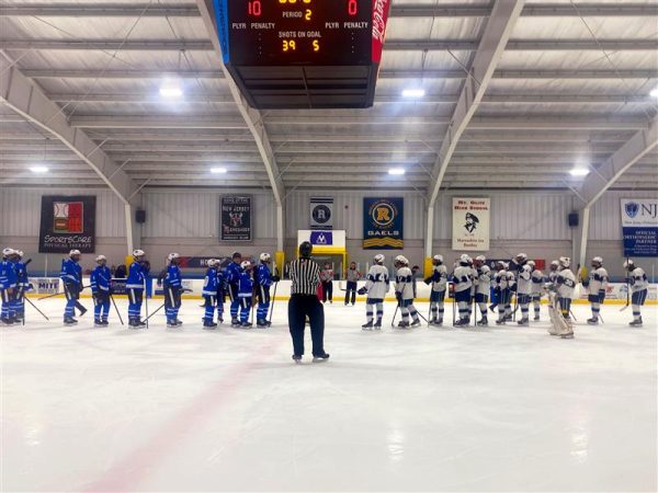 The calm after the storm: The No. 1 seeded Rams form the handshake line after beating Millburn, 10-0, in the first round of States at SportsCare Arena in Randolph, on Tuesday evening, Feb. 20.
