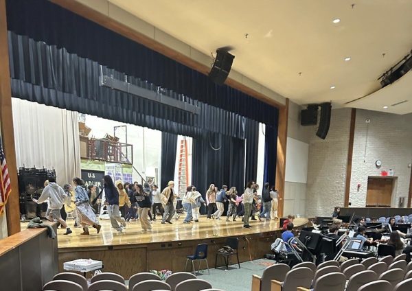 Members of the cast and student orchestra rehearse a dance number for Into the Woods. which premieres tonight, Thursday, March 21, at 7:00 p.m. in the high school auditorium, with additional shows on March 22 at 7:00 p.m. and March 23 at 1:00 p.m. and 7:00 p.m.