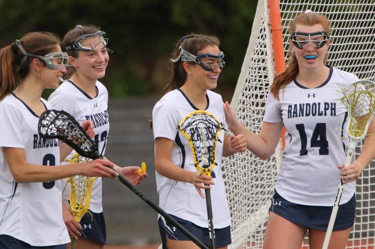 Class of 2024 Girls Lacrosse returning players (from left) Morgan Behar, Taylor Santoro, Summer Walsh and Riley Novak  celebrate a goal last season. The Girls Lacrosse team went 16-6 last year, and with this years impressive roster, the team is stacked enough to beat that record in the coming months. The season starts  on Tuesday, April 2, against Verona.