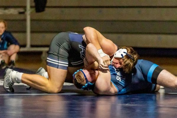 Junior captain Dean Mangiocavallo takes down a Sparta wrestler on Dec. 16, 2023. The team finished with a record of 11-16, after losing in the group finals to Mt. Olive. 
