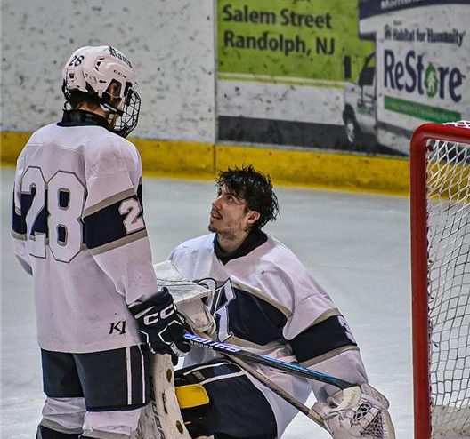 Brian Cislo (left) and goalie John Krynicki confer during the North State Sectional Final where No. 2 seeded Northern Highlands defeated No. 1 seeded Randolph, 8-3, on Thursday, Feb. 29, at Mennen Arena in Morristown, ending the Rams season with a 22-1-1 record. 