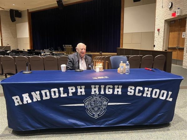 Holocaust survivor Fred Heyman celebrates his 95th birthday before speaking to students in the high school auditorium on Thursday, March 21.