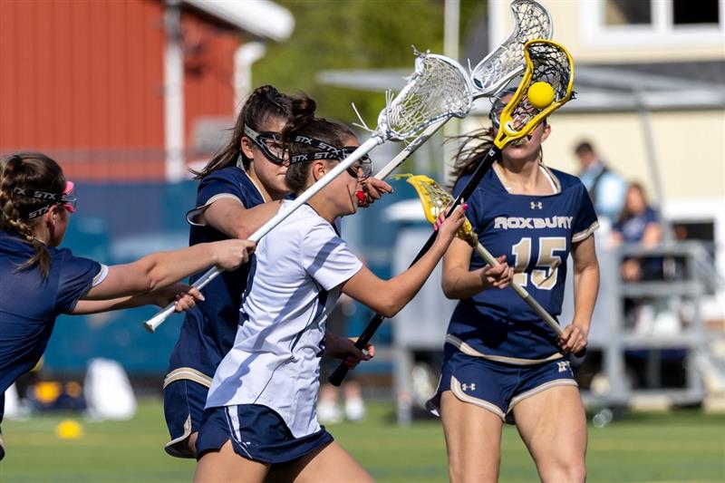 Senior Summer Walsh cradles the ball as Roxbury players attempt to defend her on the way to Randolphs blowout win against Roxbury, 18-3, in the second round of the Morris County Tournament (MCT) on Wednesday, May 1, 2024. Unfortunately, the Rams went on to suffer a loss to Mendham, 15-6, in the MCT quarterfinal round on Saturday, May 4, 2024. 