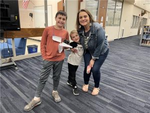 Rampage asked some of the children of RHS faculty and staff what they liked best about Bring Your Child to Work Day at the high school: 

“Playing Kahoot.” --Gerard (left), age 10, pictured with English Teacher/ Mom Cara Canfield and brother Patrick, age 5. 

