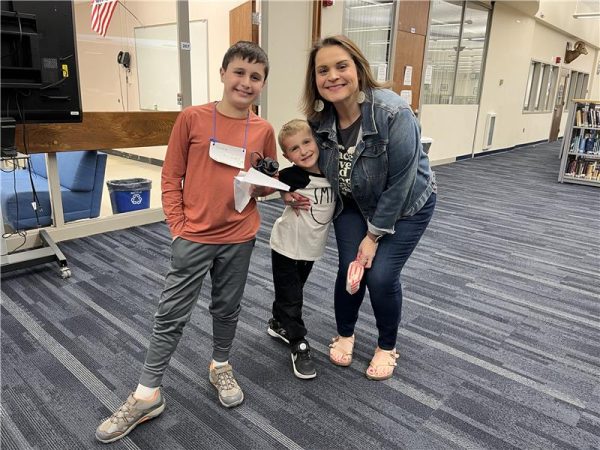 Rampage asked some of the children of RHS faculty and staff what they liked best about Bring Your Child to Work Day at the high school: 

“Playing Kahoot.” --Gerard (left), age 10, pictured with English Teacher/ Mom Cara Canfield and brother Patrick, age 5. 

