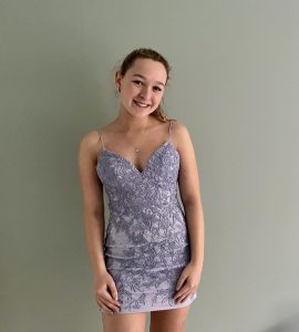 Junior Jaclyn Mars models the lovely lilac dress she plans to wear to junior prom, which is being held tomorrow night.