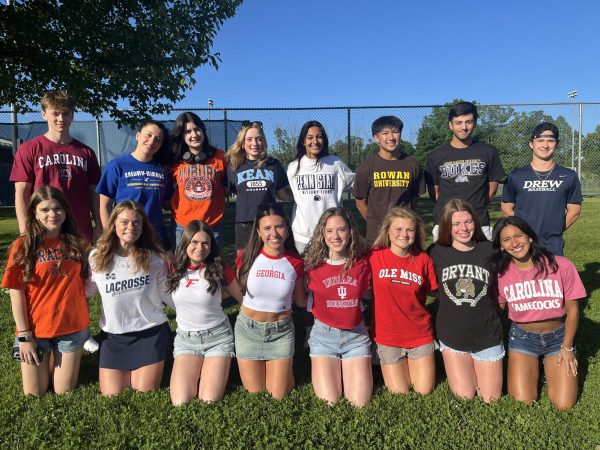 Members of the RHS Class of 2024 show off their College Commitment shirts on National Decision Day, June 1, at the high school