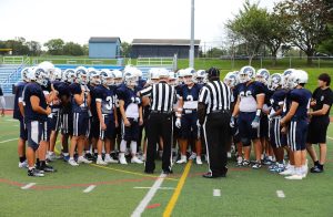 The Rams meet with refs to review the rules of play before their final, pre-season scrimmage against Ridge.  