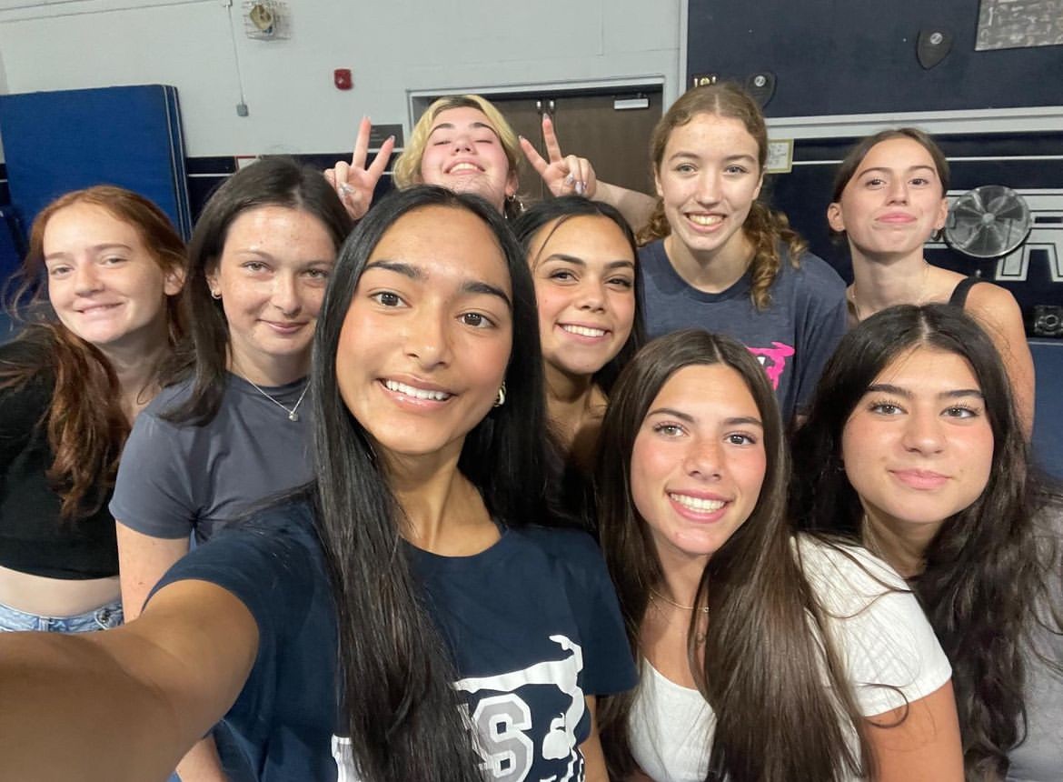 Members of the Randolph Gymnastics team share smiles of victory after beating West Milford on Tuesday, September 17. 