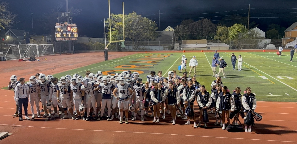 Rams Football players and cheerleaders gather on the field to celebrate their 28-9 victory @ Orange on Friday, Oct. 18.