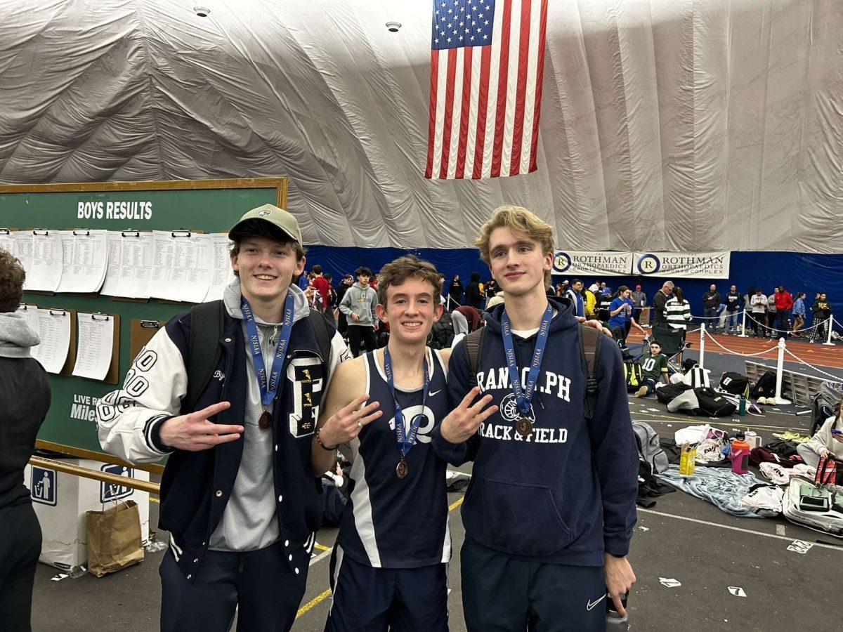 From left: Kennan Byers, Thomas Amato and Preston Gumann hold up three fingers to show they placed at the NJSIAA Group Championship during last winter's indoor track season, on February 17, 2024.  