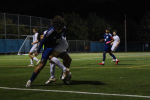 Julian Hernandez fights for the ball against a Parsippany Hills player. 
 

 
