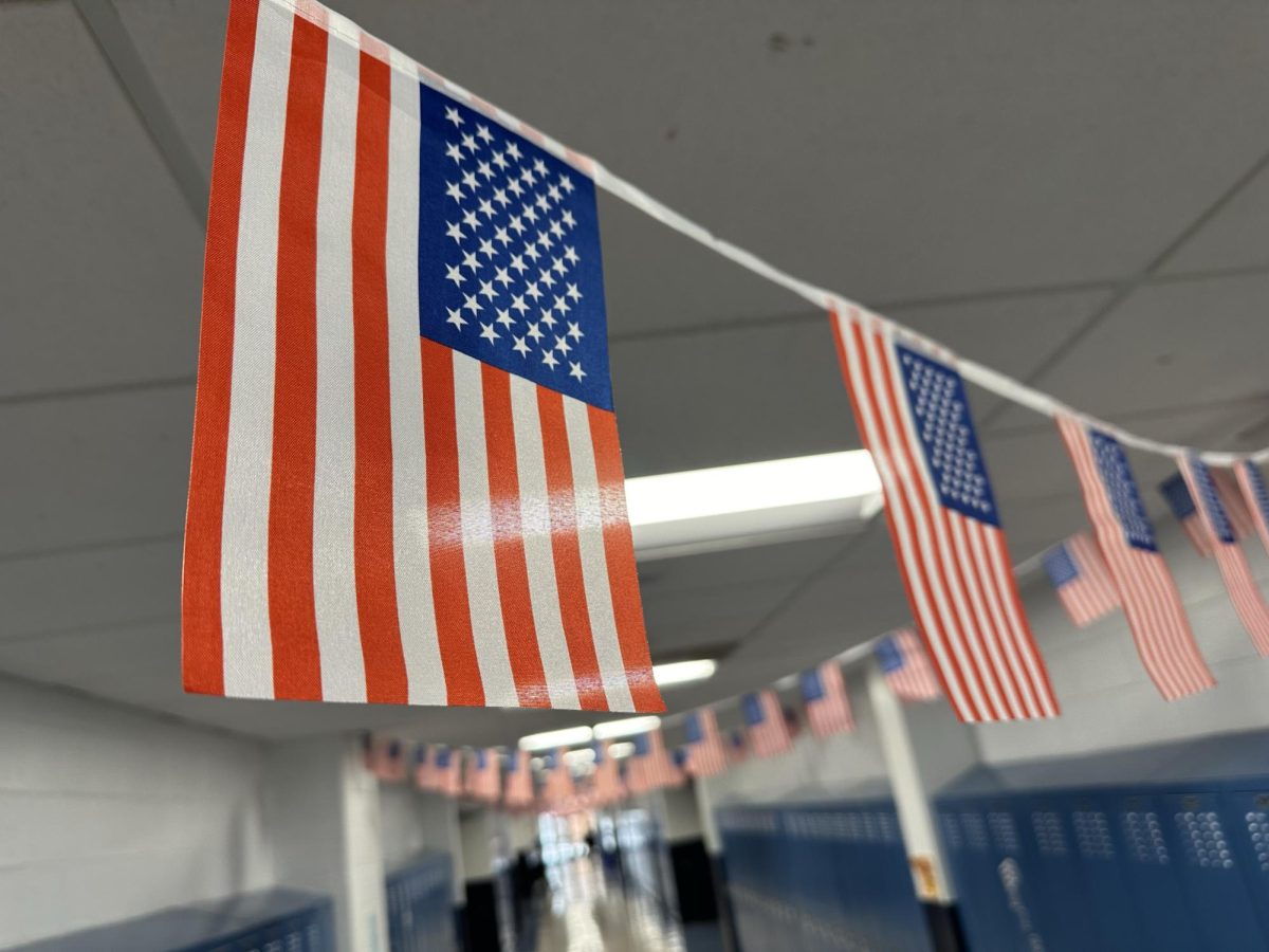 American flags hang in high school hallways to honor veterans.