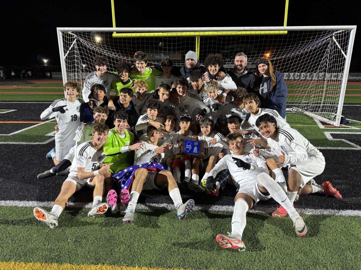 Randolph Varsity Boys Soccer poses with the first-place trophy after winning the state sectional championship over Ramapo on Saturday, Nov. 16. 