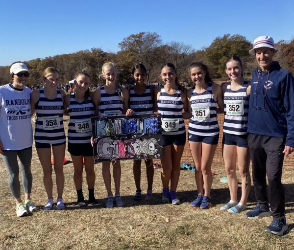 Varsity Girls XC poses for a pic at one of this year's meets. From left: Coach Jenna, Jaidyn Young, Sam Cerulo, Julianna Young, Anjali George, Liliana Colasante, Keili Semler, Lilah Willis and Coach Higgins.