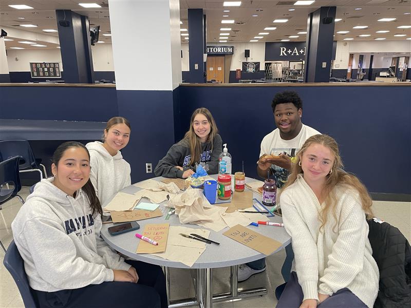 Seniors assemble bagged lunches for residents of homeless shelters in Newark as part of a Project KIND service-learning project on Nov. 21 and 22. Clockwise, from left: Livia Fontes, Lucy Girardi, Isabella Carreira, Nick Hart, Ava Olsen.