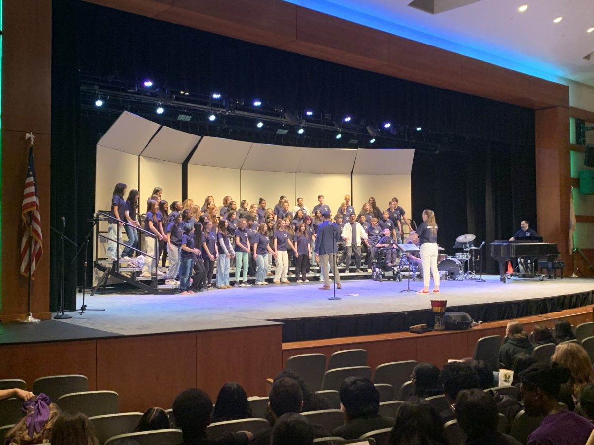 RHS Choir students work with Dr. Wilson, director of the Department of Music at SUNY New Paltz, at the annual Choralpalooza music festival on Monday, Nov. 25, at Ridge High School.