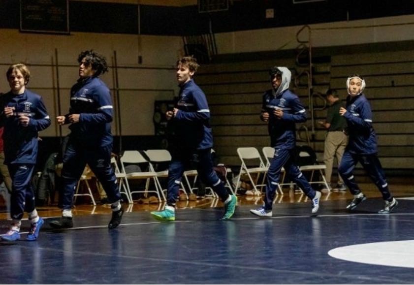 Randolph Wrestling team members warm up before a match.