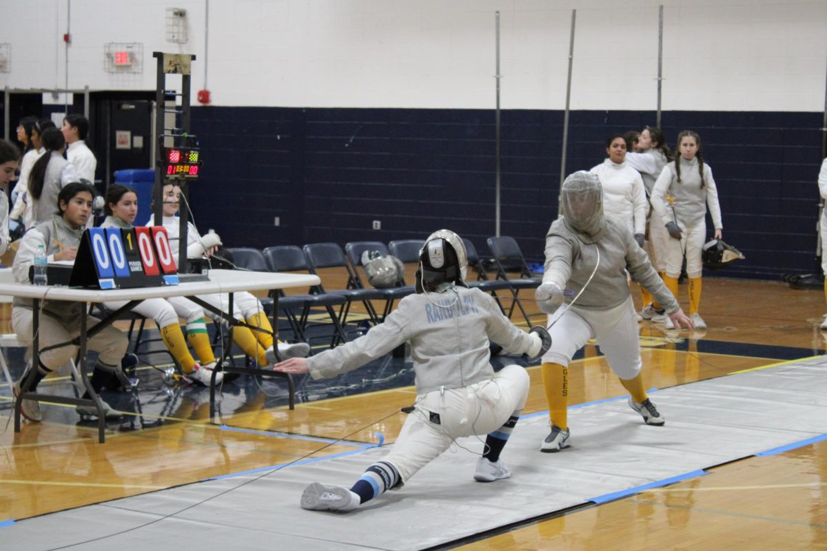 Andrea Gil (left) hits her opponent out of a long distance attack