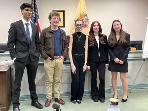 The RHS Mock Trial defense attorneys and witnesses dominated the opposing plaintiff’s team on Tuesday, Jan. 7. From left: Junior Rohan Gupta, senior Ryan Schorr, sophomore Amelia Longa, sophomore Grace Kellett and junior Emily Lindsey.  



