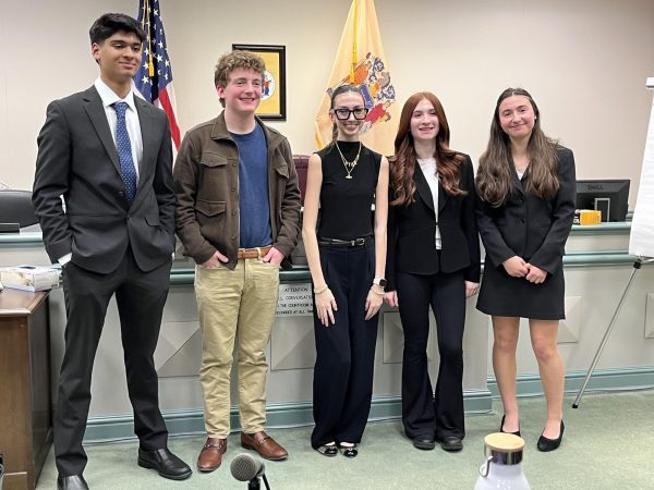 The RHS Mock Trial defense attorneys and witnesses dominated the opposing plaintiff’s team on Tuesday, Jan. 7. From left: Junior Rohan Gupta, senior Ryan Schorr, sophomore Amelia Longa, sophomore Grace Kellett and junior Emily Lindsey.  



