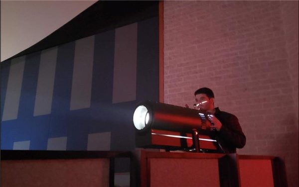 A tech crew member operates the spotlight for a recent RHS stage production. 