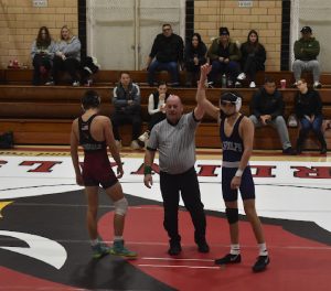 Sophomore Aiden Madayag-Williams is declared the winner of the 132-lbs match against Pompton Lakes on Saturday, Jan. 11. 

