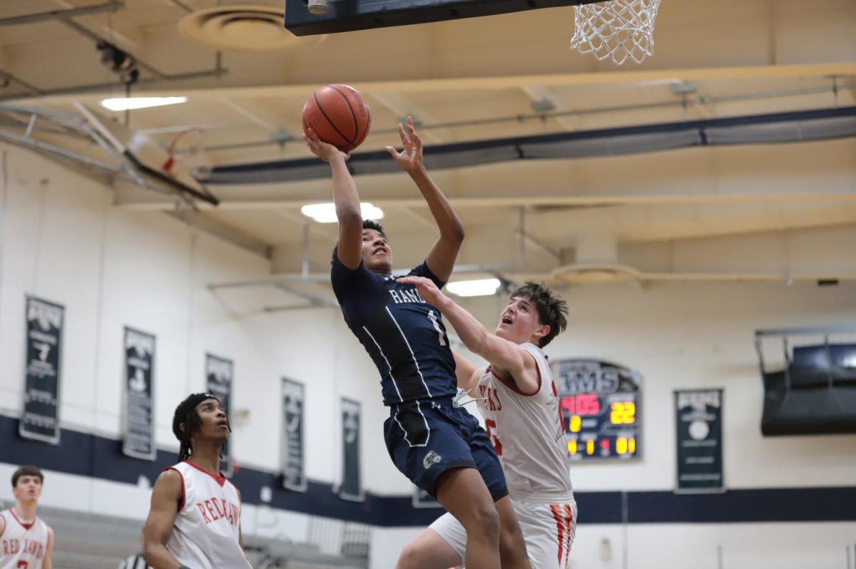 Zayne Carswell goes up for a difficult layup trying to draw a one-and-one. 