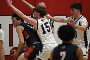 Jack Smith stands firm in the paint, protecting it from the Mendham player in the first round of the NJSIAA Tournament on Feb. 26, 2025.  


