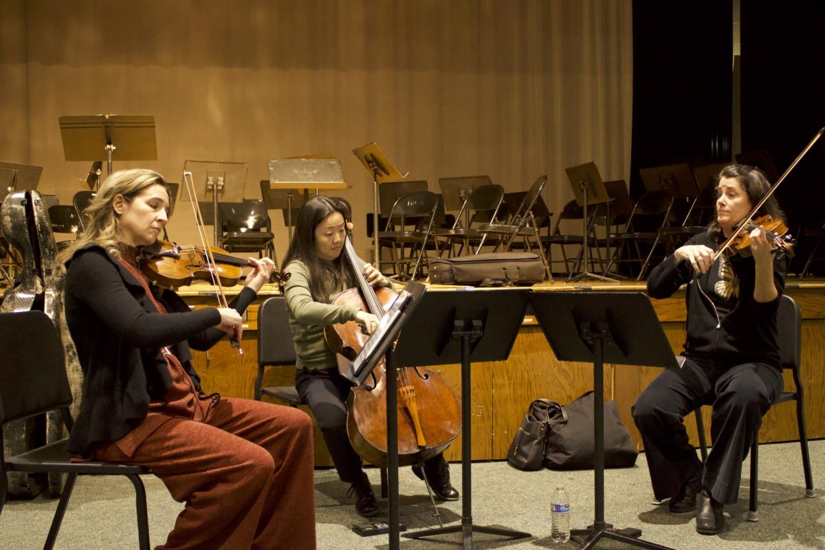 Montclair State professors and musicians (from left) Deborah Buck, Tomoko Fujita and Kathryn Lockwood perform for RHS and RMS orchestra members on Monday, Feb. 24, at the high school.




