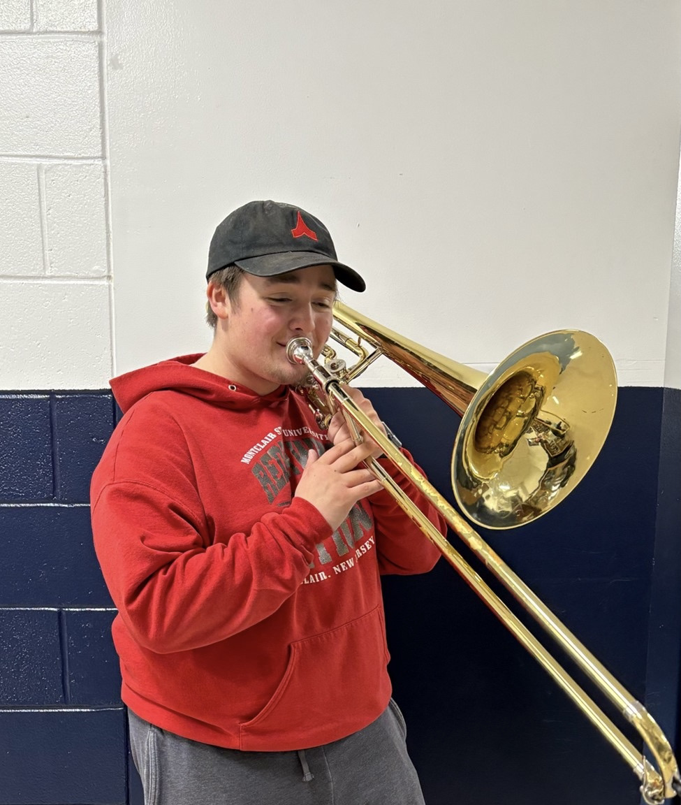 Senior Gerald Creighton plays his primary instrument, the trombone, which he learned in the fifth grade. The trombone was the first of 12 instruments he has mastered, including the saxophone, euphonium, tuba, trumpet, French horn, viola, violin, piano, guitar, bass and his voice. 