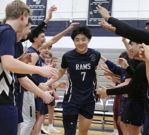 Senior co-captain Kevin Tinio runs through a tunnel of players on Senior Night, Wednesday, April 23. 