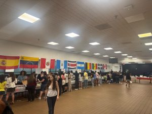 Members of the Spanish and French Honor Societies and Team Harmony host the annual Global Café in the high school Commons on Friday, May 2, 2025.