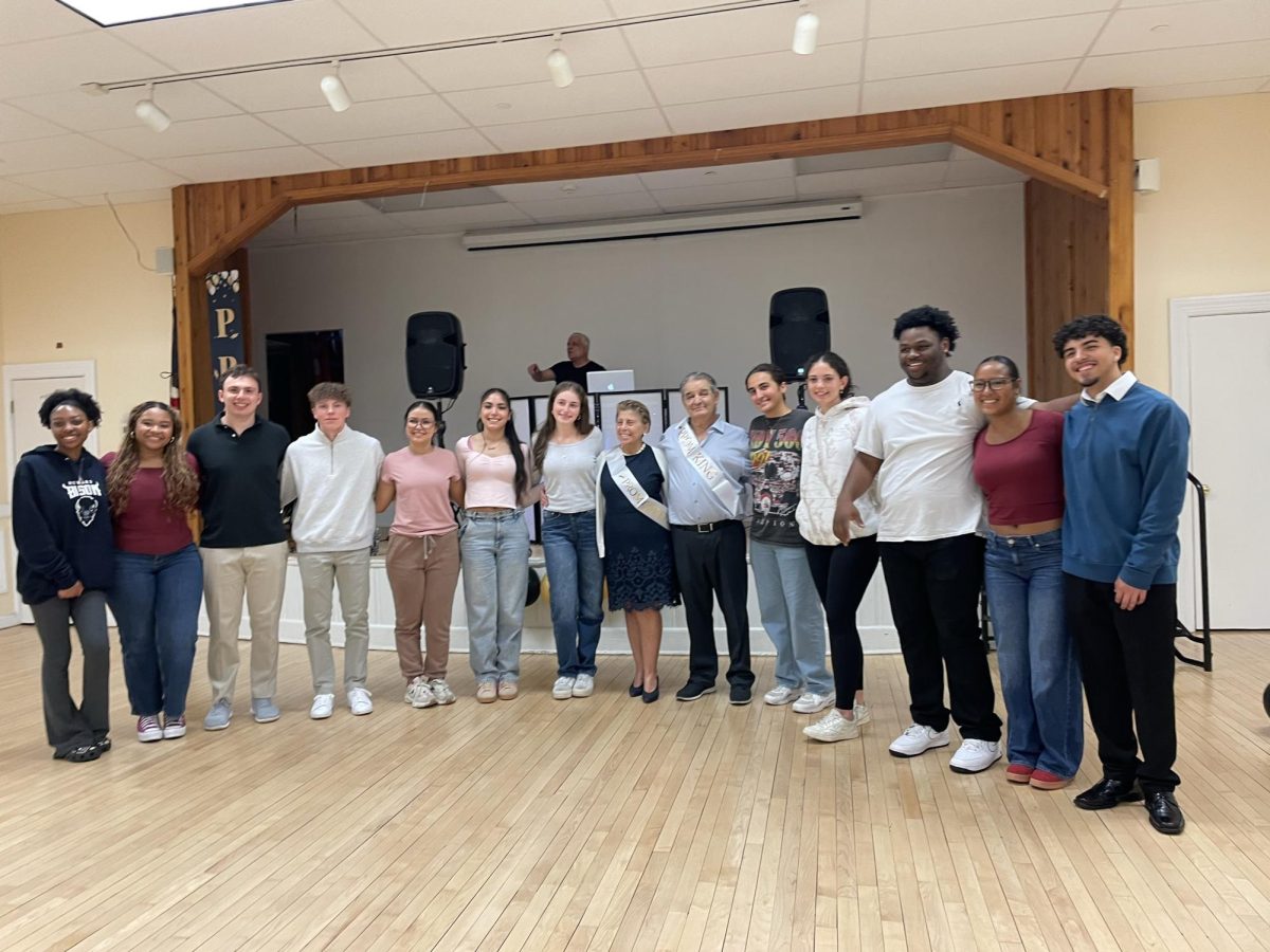 RHS seniors pose with the Senior Citizen Prom king and queen, Giuseppe Esposito and Ninetta Esposito, at the Randolph Recreational Center on May 6,  2025. 