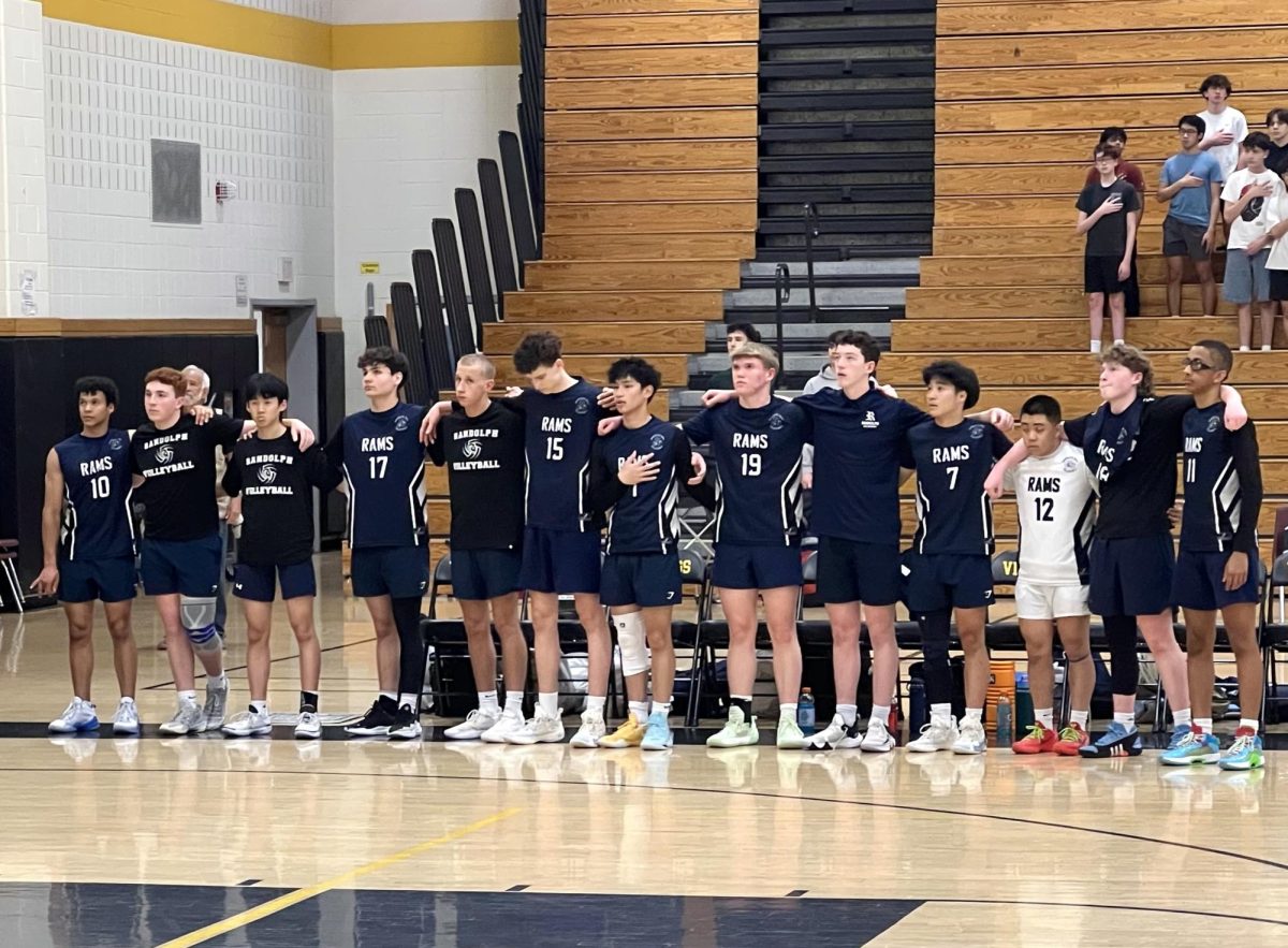 Boys Volleyball lines up for the National Anthem prior to the Group 2 state final on Wednesday, June 11. 